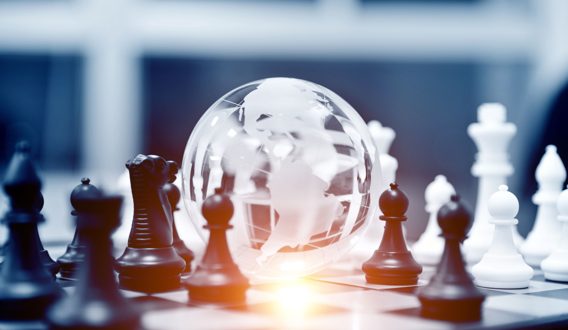 Globe and chess pieces
